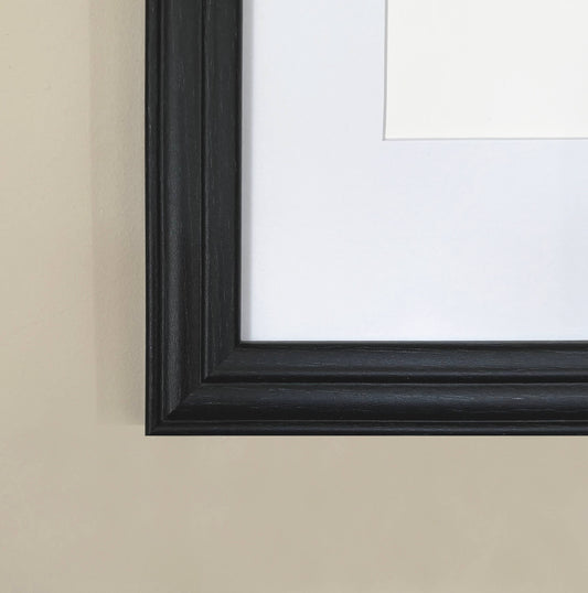 Black picture frame on a beige wall