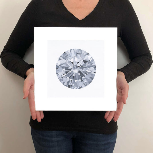 A giclée fine art print of a diamond gemstone on a light stone background. This image illustrates the print size.