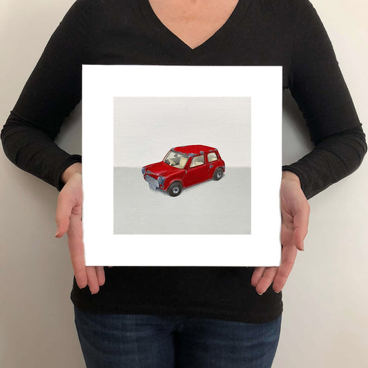 A giclée fine art print on paper of a toy car on a light grey background. This image illustrates the print size.