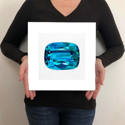 A giclée fine art print of a zircon gemstone on a very pale stone background. This image illustrates the print size.