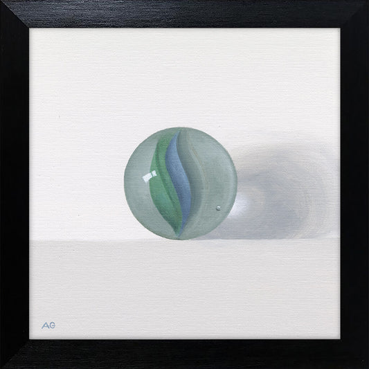 Framed painting of a glass toy marble