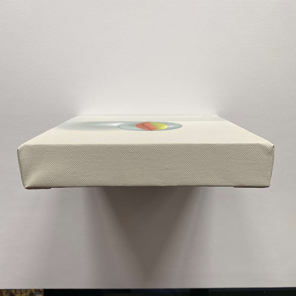 original realism acrylic painting of a yellow and red retro glass marble game painted by Amanda Gosse