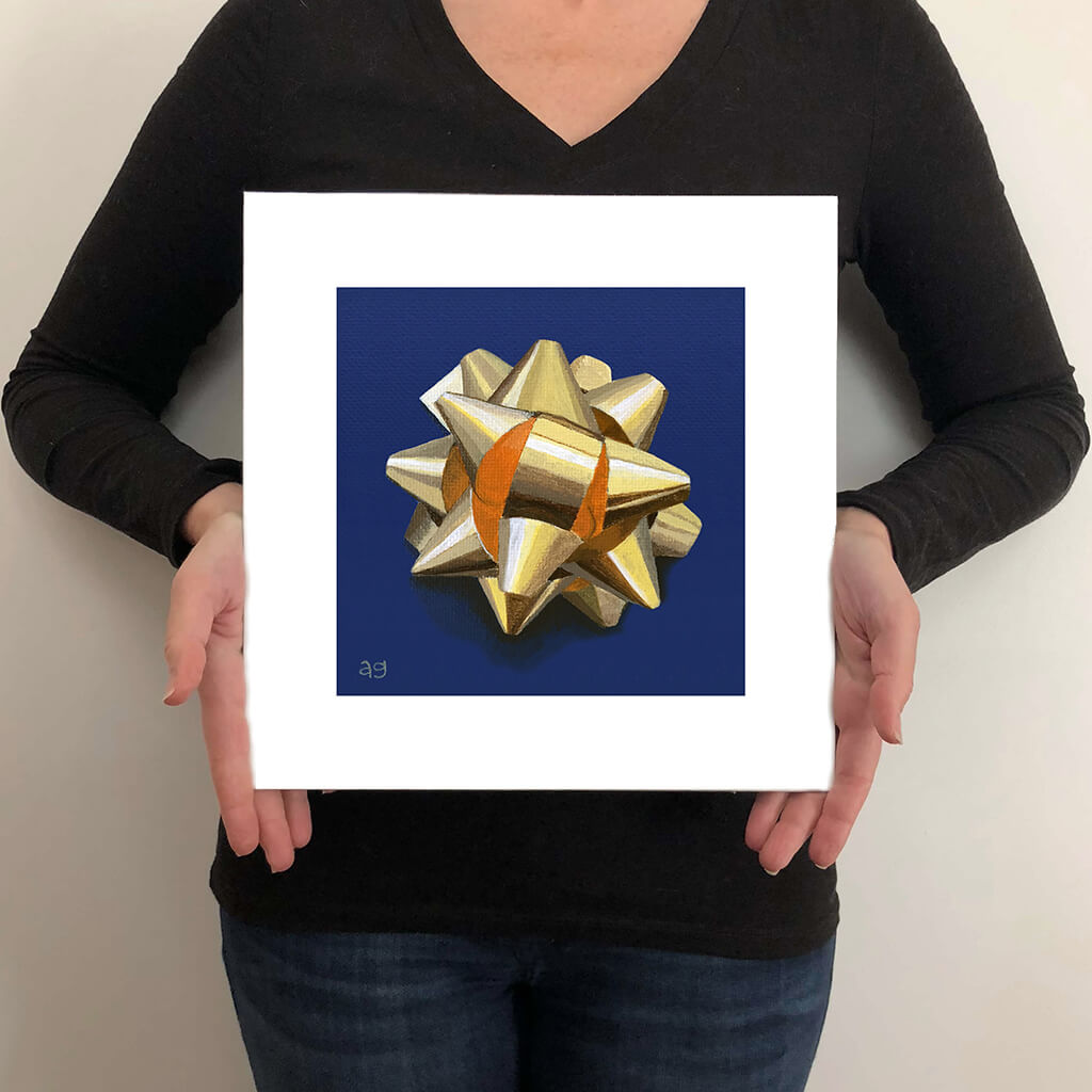 Size guide for a giclée fine art print of a gold gift bow on a cobalt blue background.