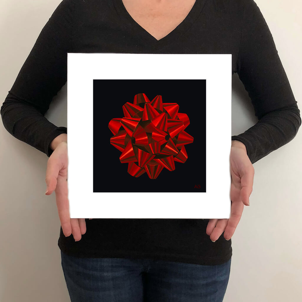 Fine art print of a red foil gift bow against black background by Amanda Gosse artist size guide