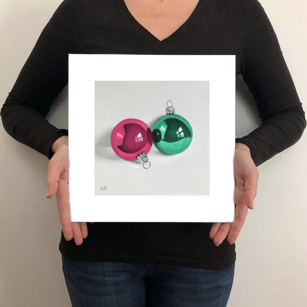 A painting of two Christmas tree ornaments, glass baubles in bright pink and green by Amanda Gosse giclée fine art print size guide