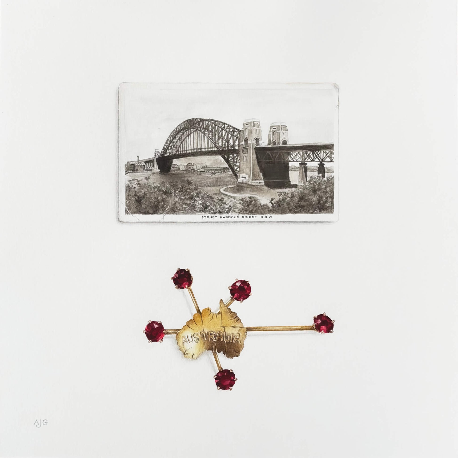 Australian brooch with red gemstones and gold accents on a white background with sepia photo of Sydney Harbour Bridge