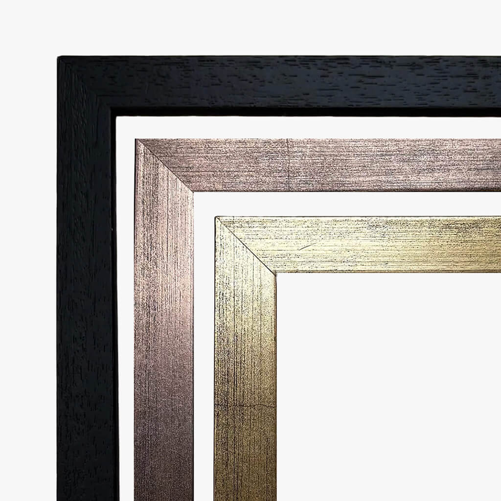 Close-up of three picture frame samples with woodgrain finish in black, bronze and gold.
