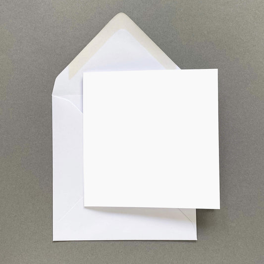 Single blank square greetings card on grey background