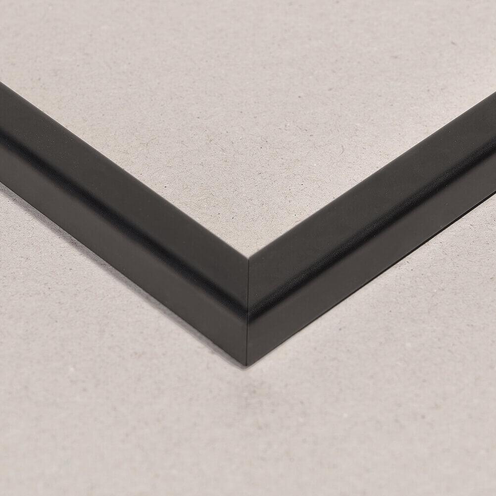 Detail of a plain black lacquer picture frame.