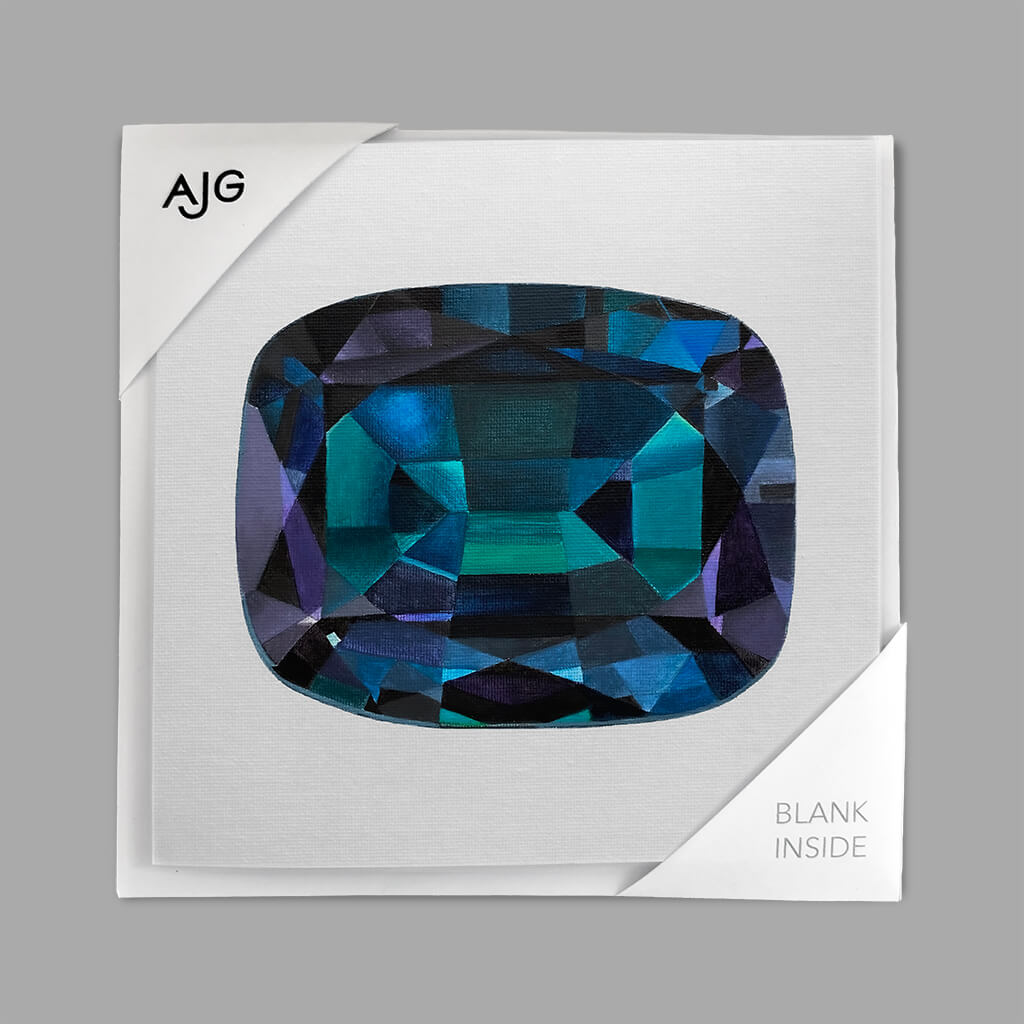 Alexandrite gemstone greetings card card with 'AJG' branding.