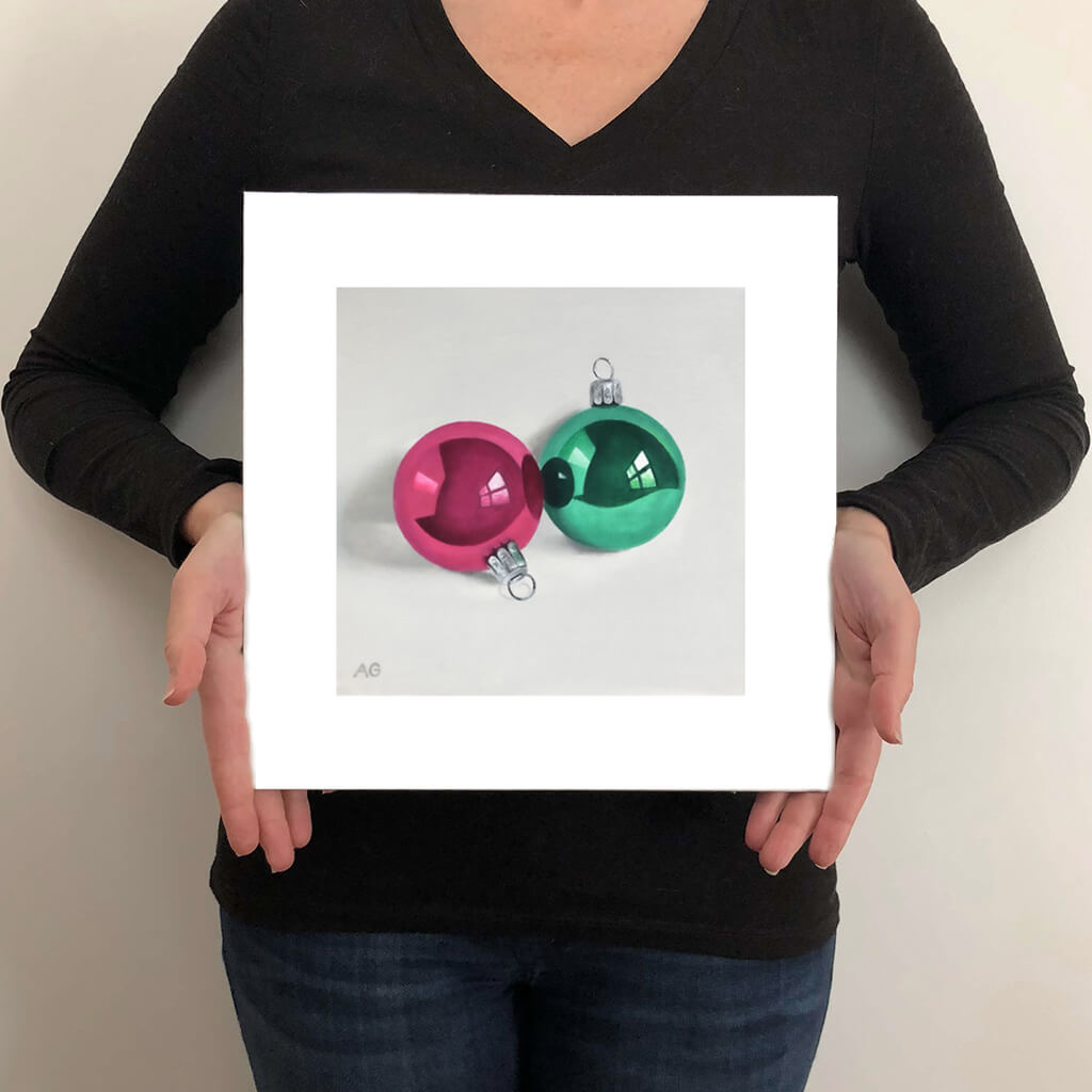 A giclée fine art print on paper of Christmas Baubles on a light grey background. This image illustrates the print size.