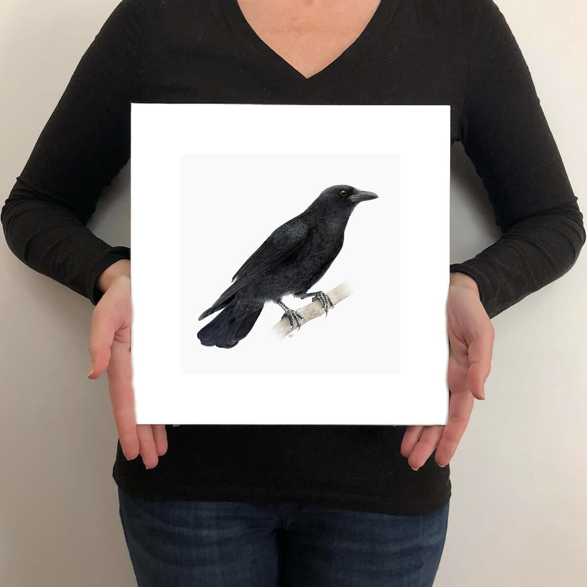 A giclee fine art print on paper of a crow bird on a light grey background. This image illustrates the print size. 