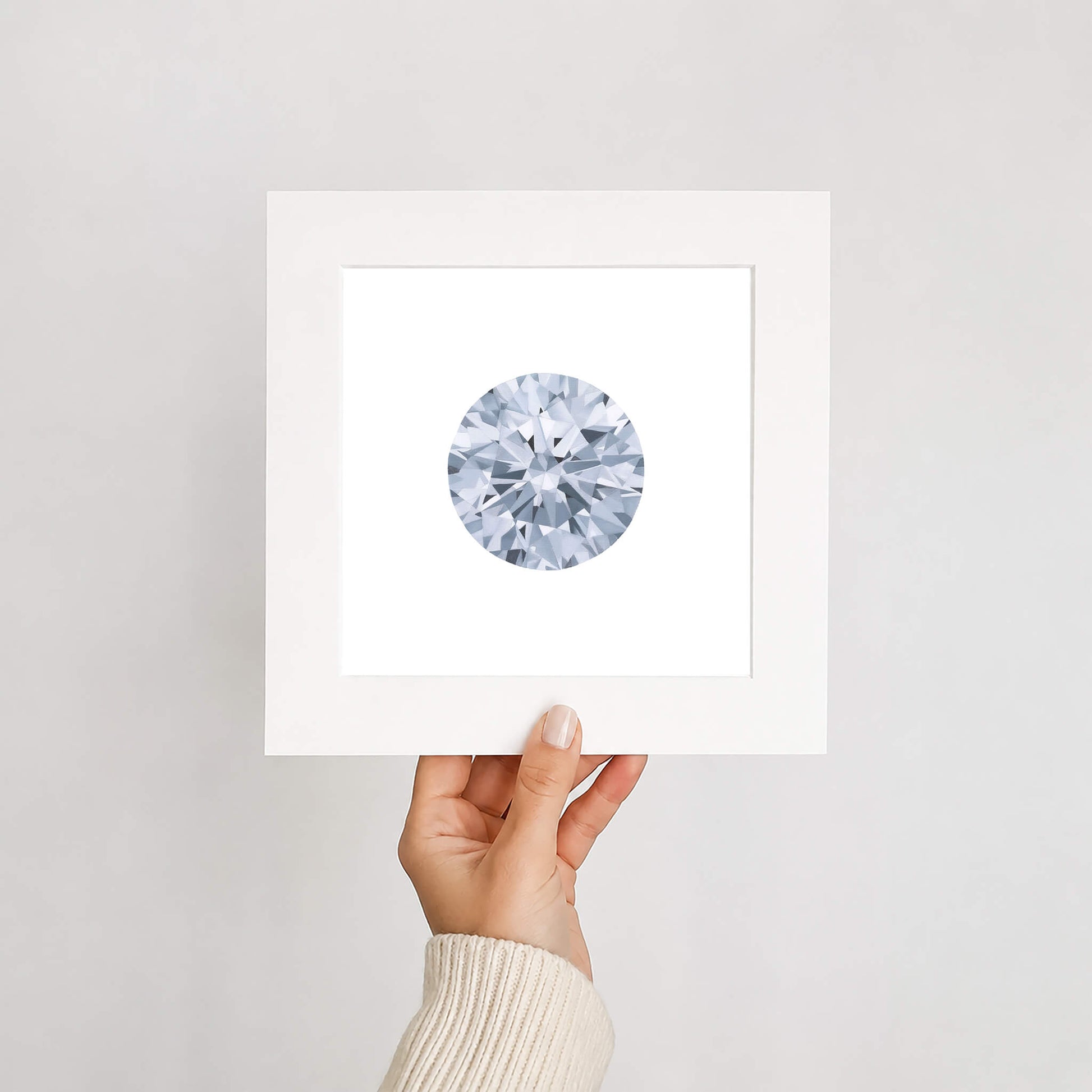 Round diamond art print held by a hand on a white background