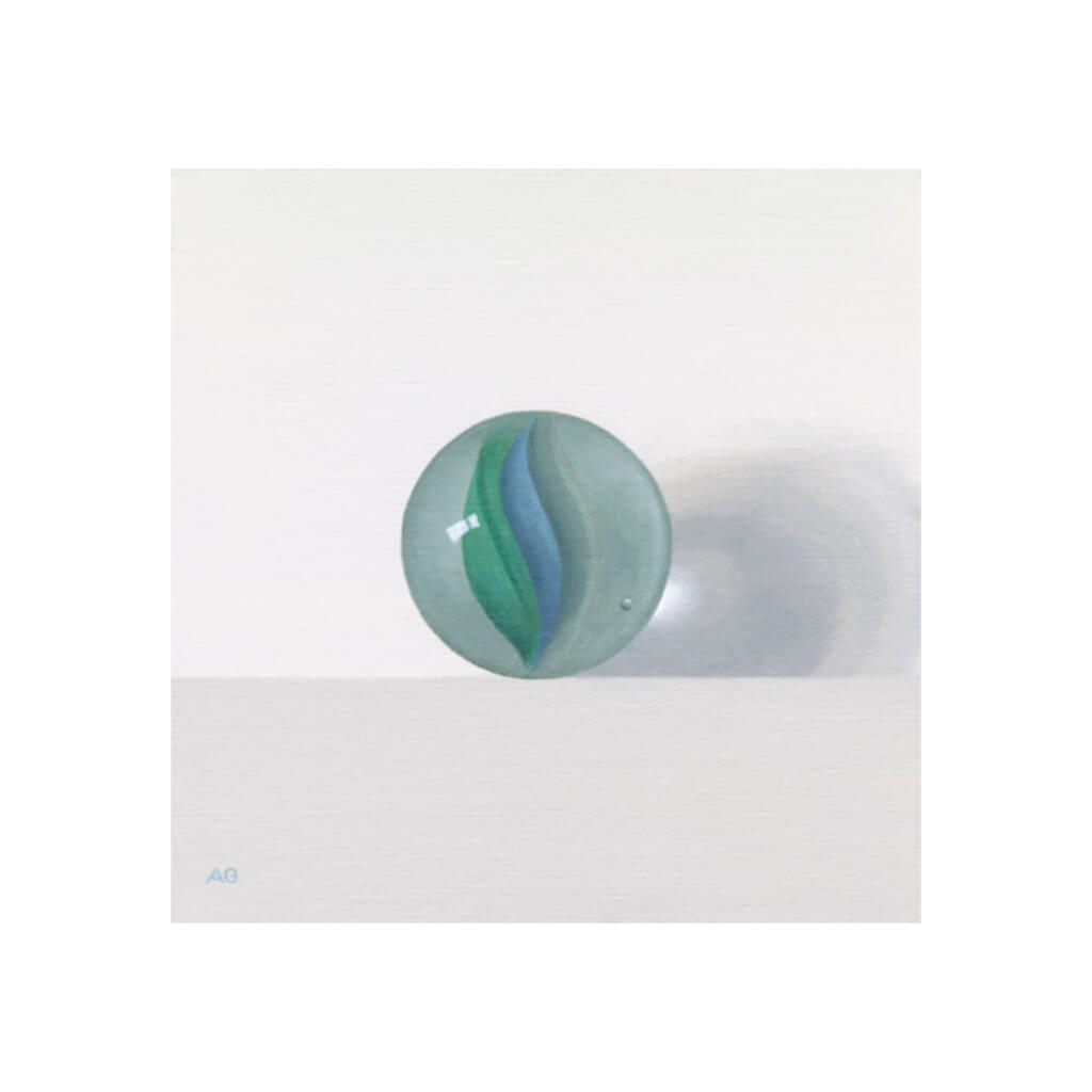 A giclée fine art print of a glass marble, against a pale neutral colour background.