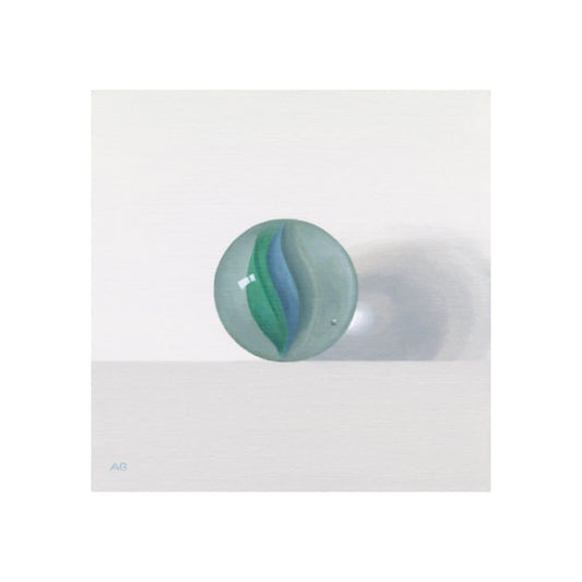 A giclée fine art print of a glass marble, against a pale neutral colour background.
