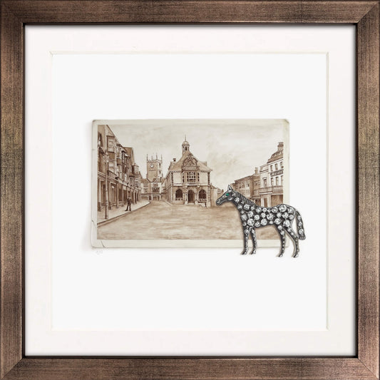 Framed artwork with a diamond horse brooch and sepia street scene photo of Marlborough Wiltshire