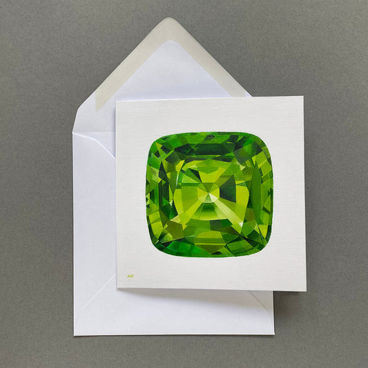 Greetings card with a green peridot gemstone design on a pale grey background