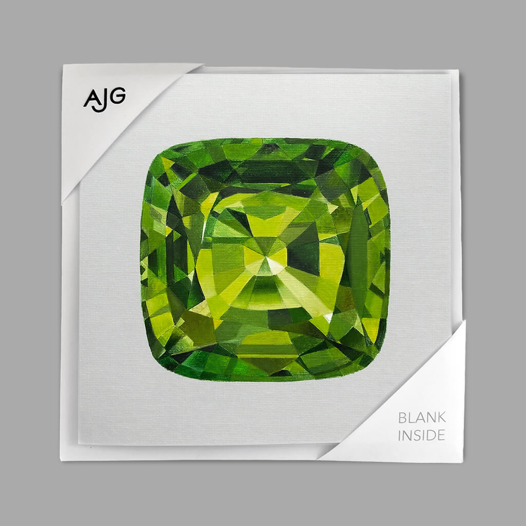 Greeting card with a green gemstone design on a pale grey background with AJG logo