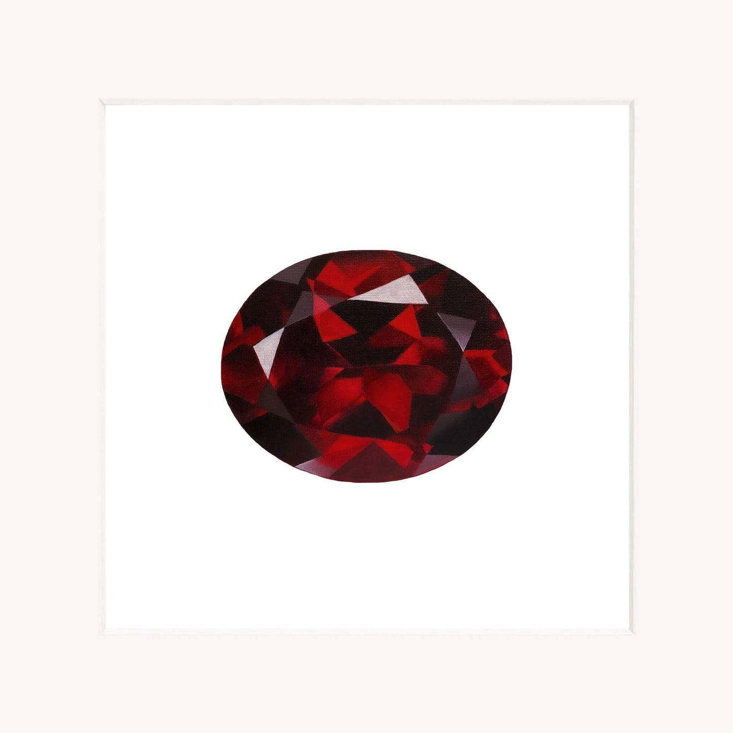 Red garnet gemstone on a white background