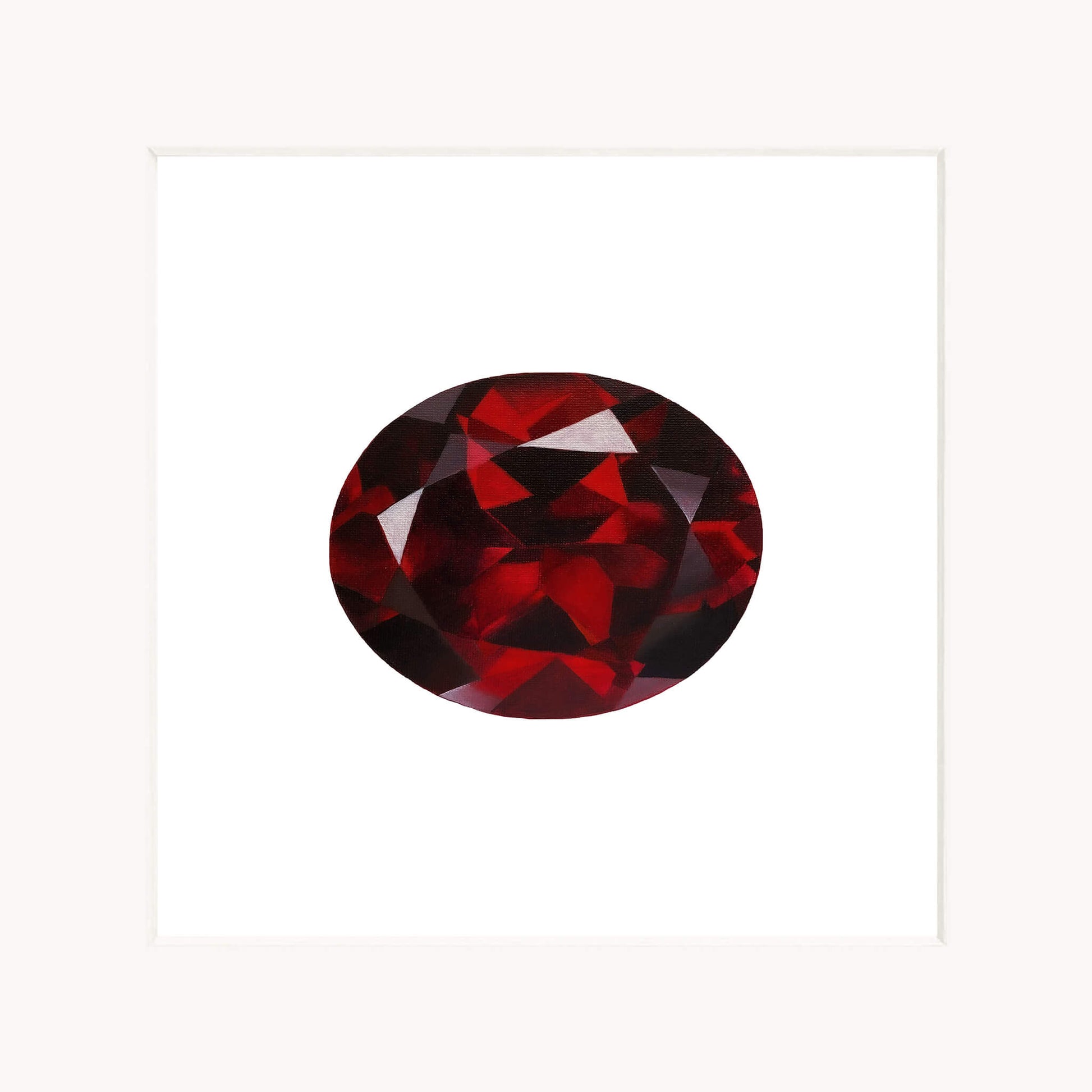Red garnet gemstone on a white background