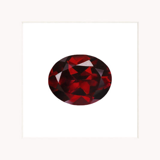 Red garnet gemstone on a white background