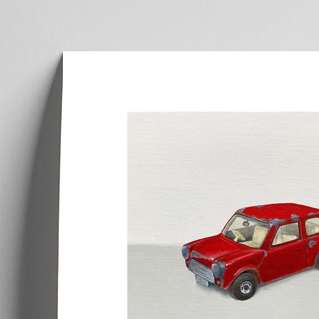 Giclée fine art print of a red toy car on a pale grey background. This image shows a section, to highlight the detail.