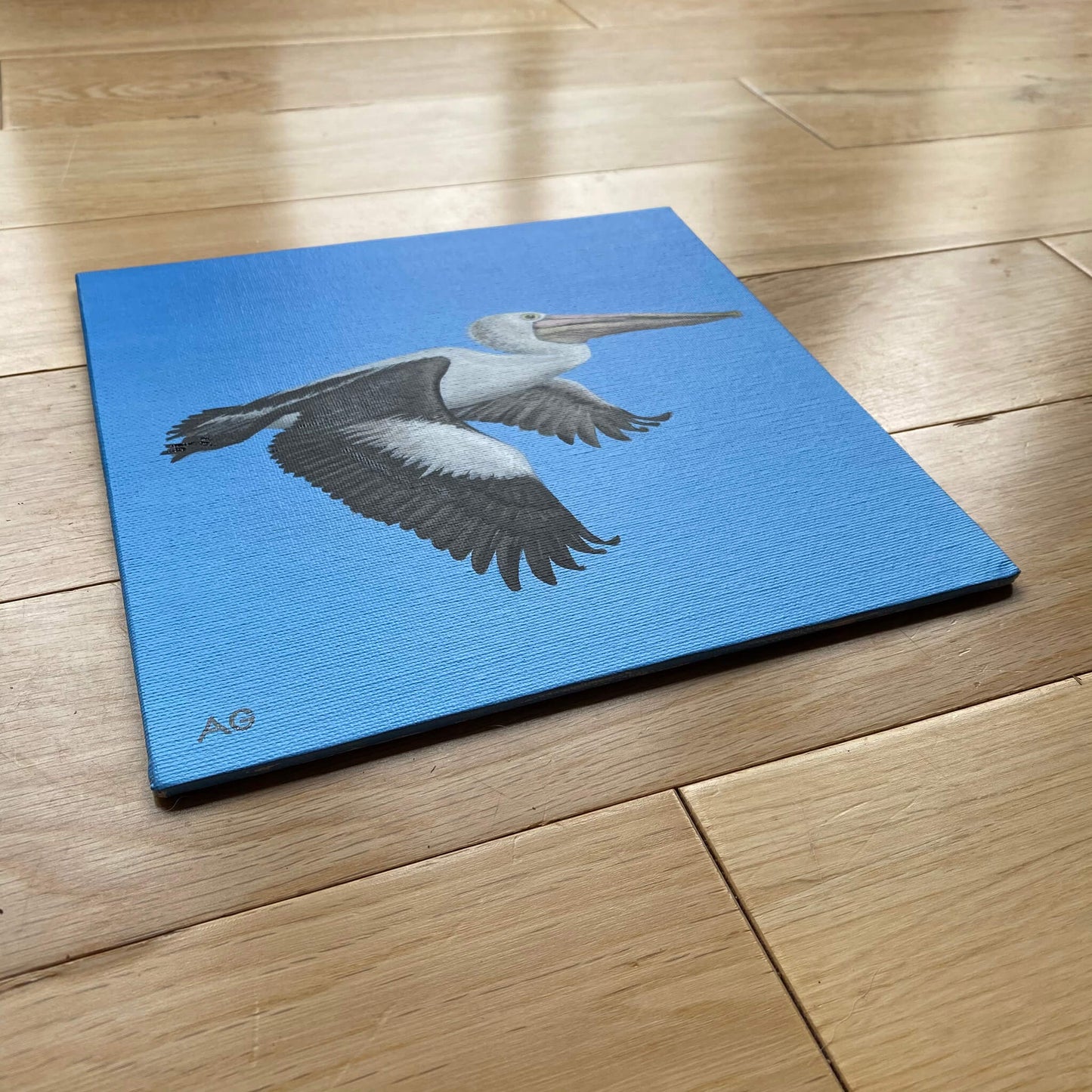 Pelican in flight painting by Amanda Gosse. Original acrylic artwork on canvas panel side view. 