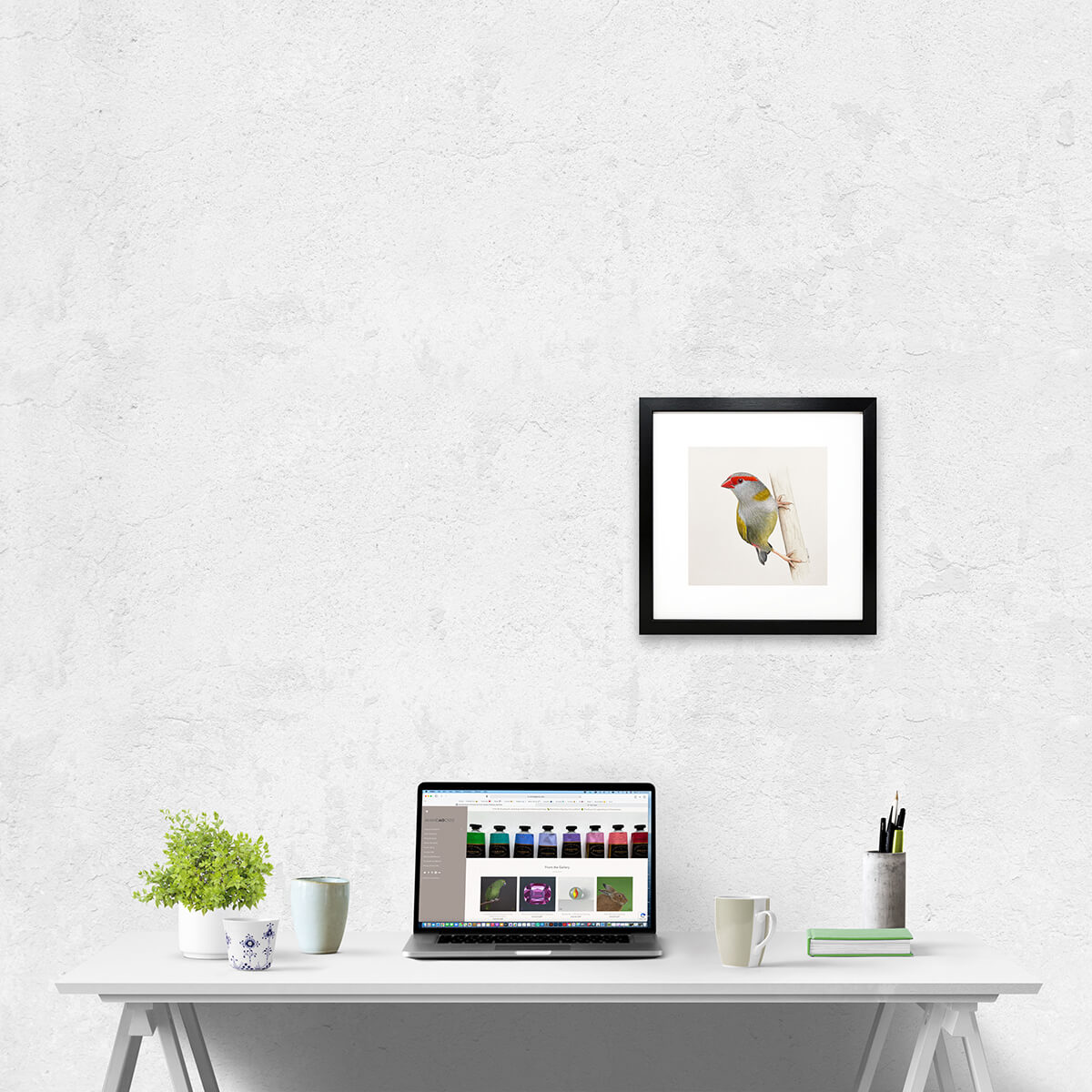 Original gouache on paper painting of a red-browed finch bird by artist Amanda Gosse in room setting