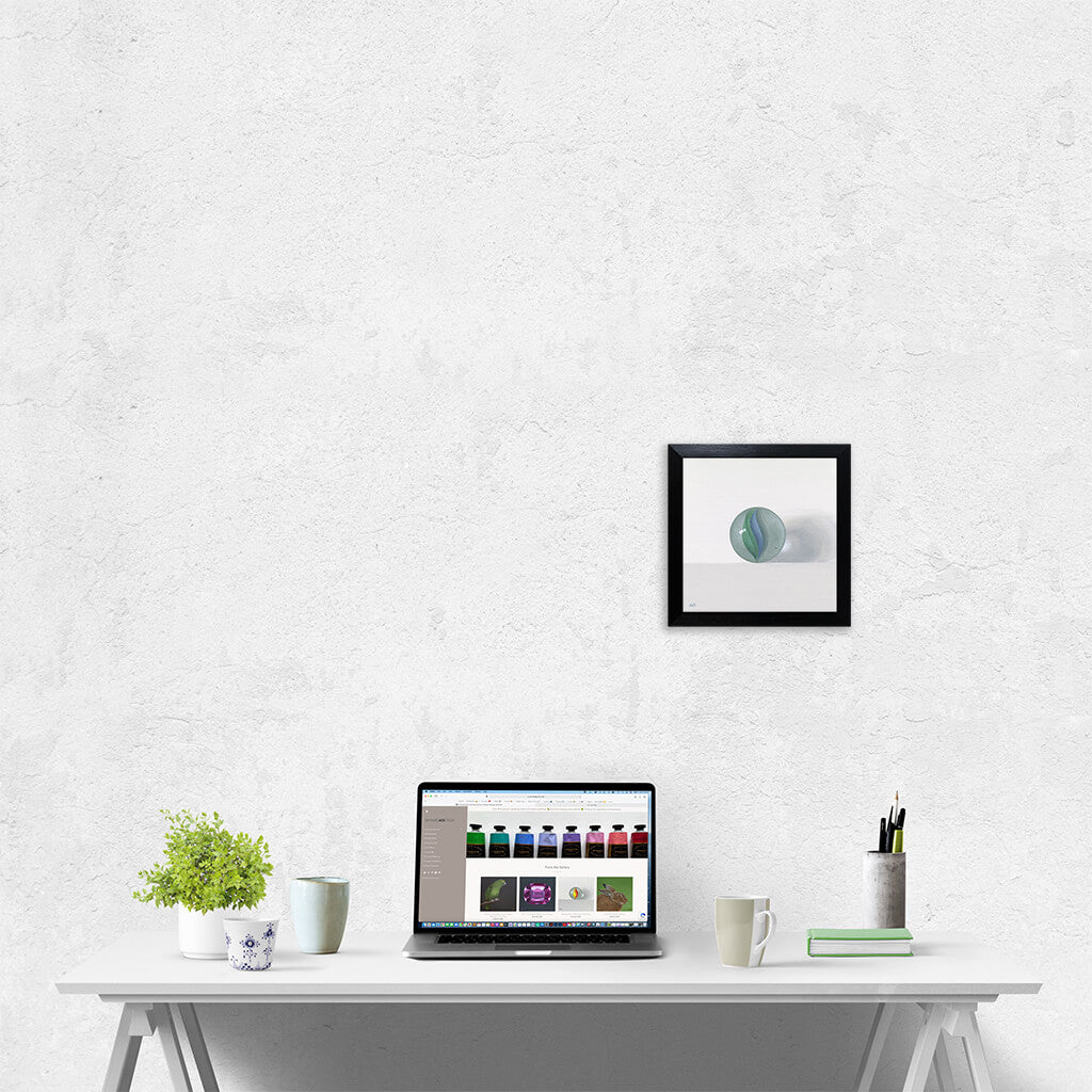 A framed painting of a marble on a wall